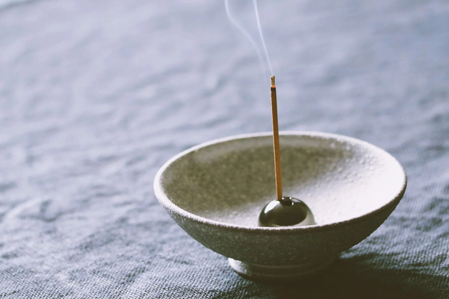 Japanese rolled incense in incense dish, by Ume Incense