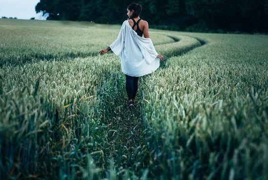 Woman walking in field peacefully