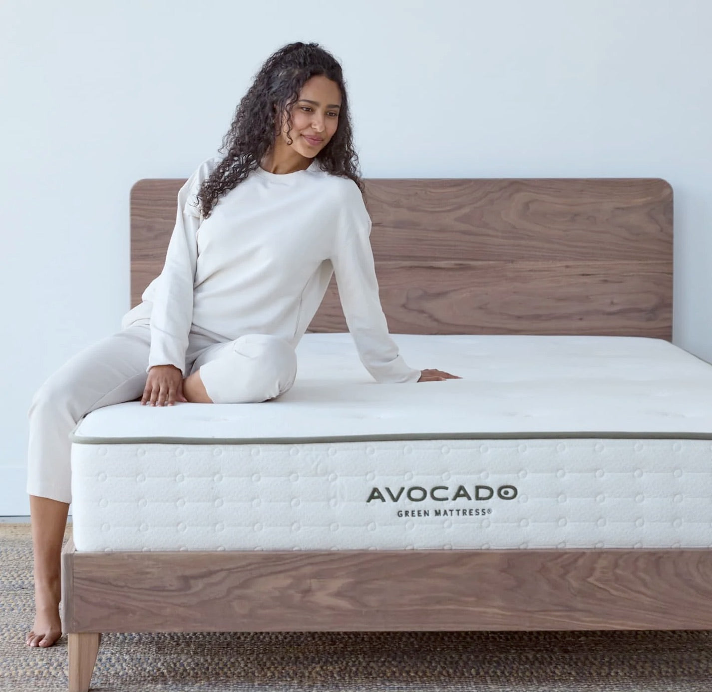 Avocado Mattress, woman sitting on bed