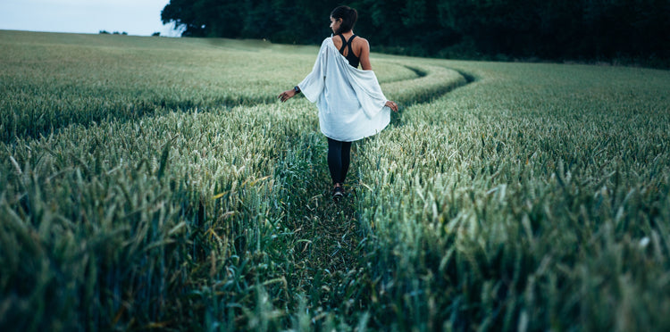 woman walking peacefully in field