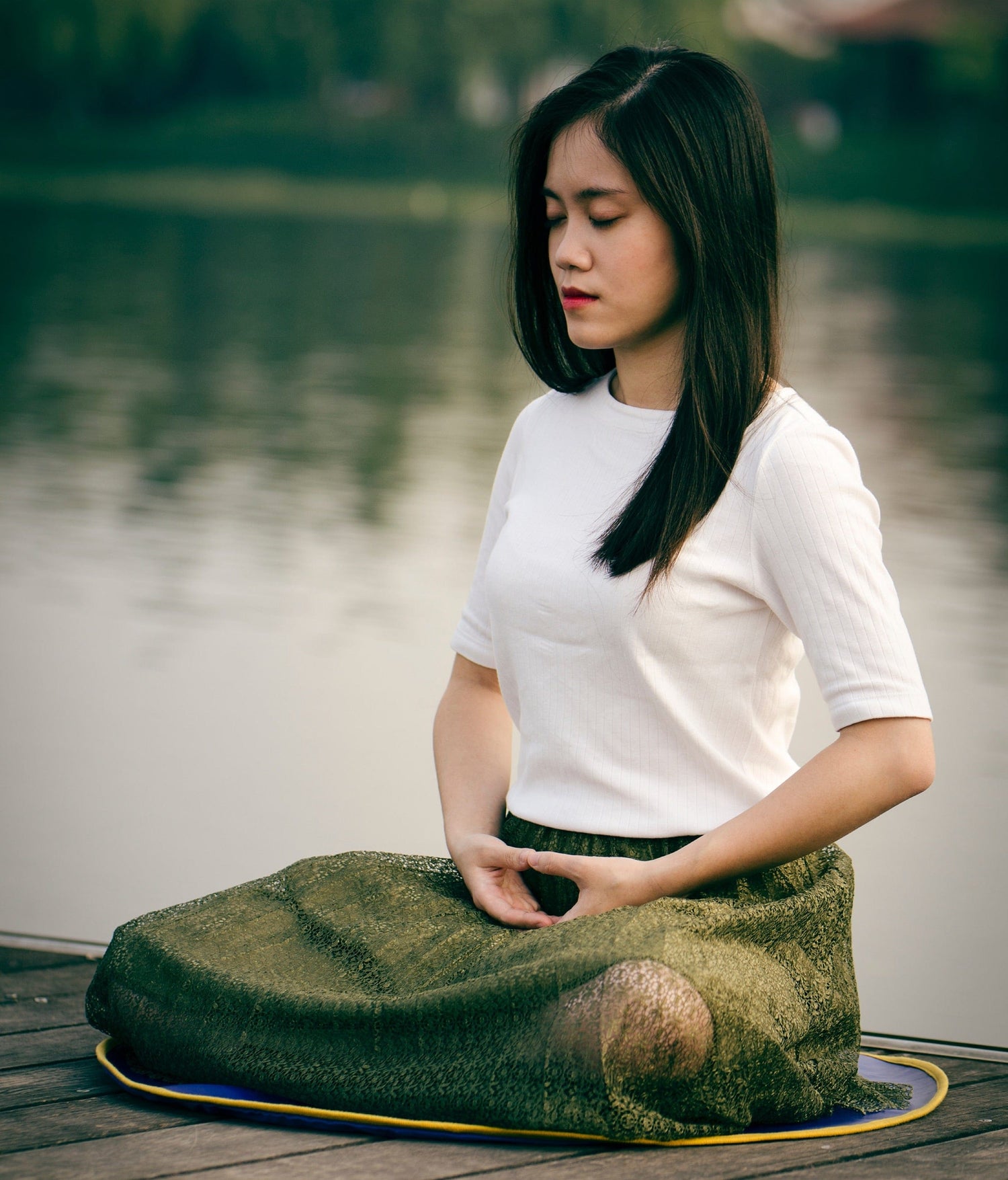 Woman meditating outdoors