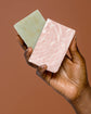 Sade Baron hand holding La Rose Pink Clay Soap